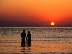Couple Holding Hands at Sunset Over the Bay of Alcudia, Mallorca, Balearic Islands, Spain